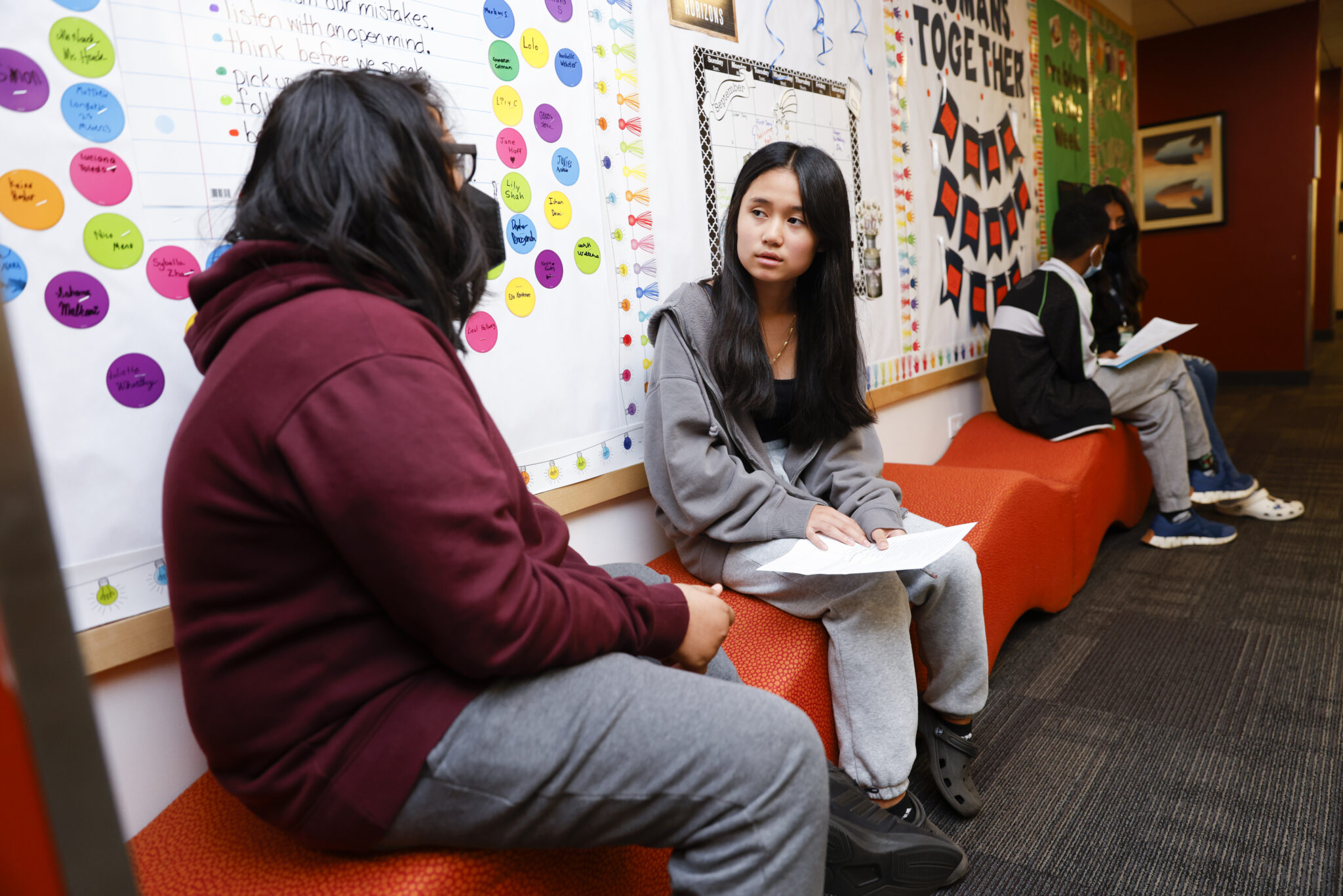 Jess stands in front of Lewis Hamilton's F1 Mercedes car