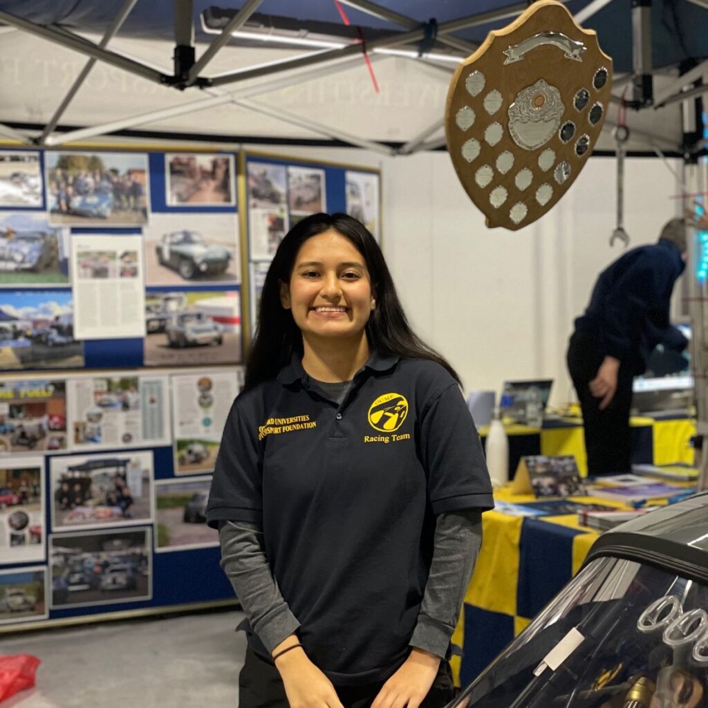 Jess smiles proudly in the garage at the Oxford University Motorsports Foundation