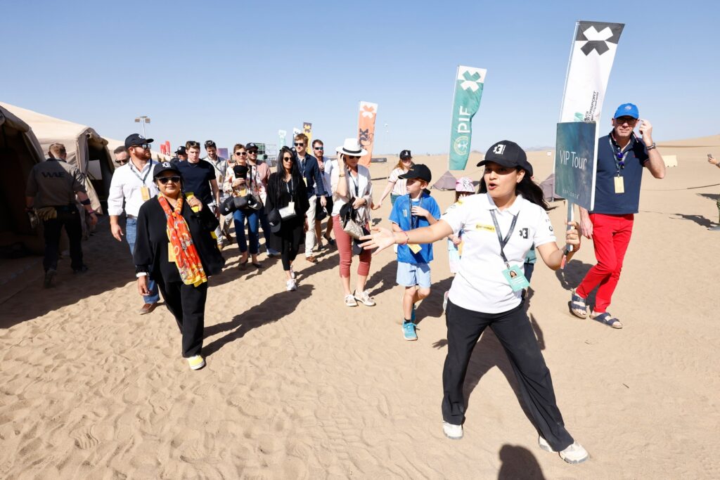 Jess leads a VIP tour through the deserts of Jedah Saudia Arabia at an Extreme E race in February, 2024