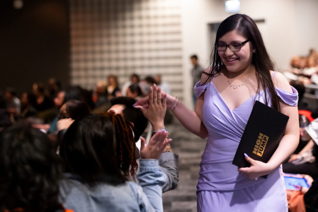 Students celebrating receipt of diploma