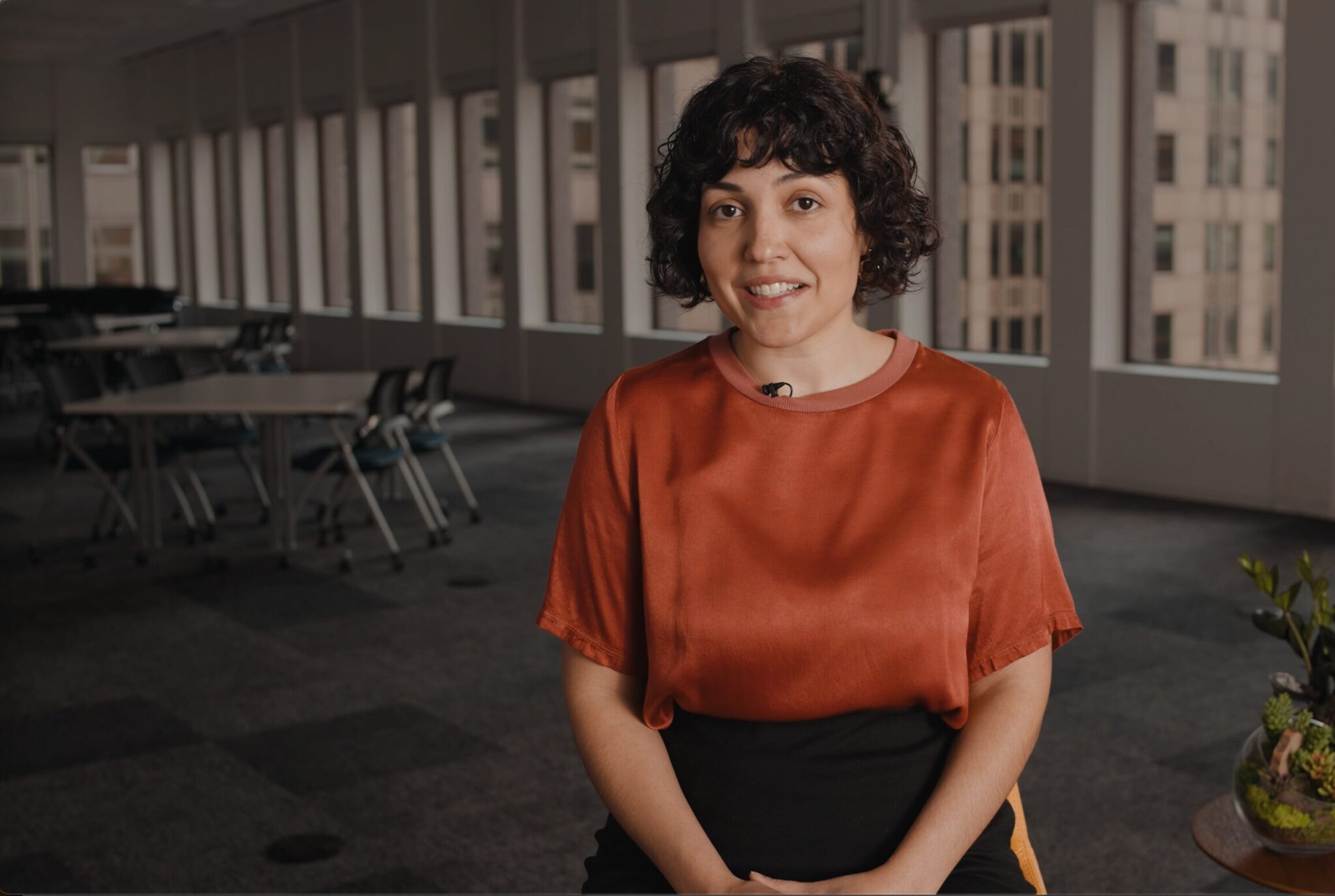Jess stands in front of Lewis Hamilton's F1 Mercedes car